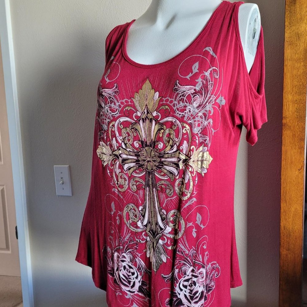 Cold Shoulder with gold stenciling.